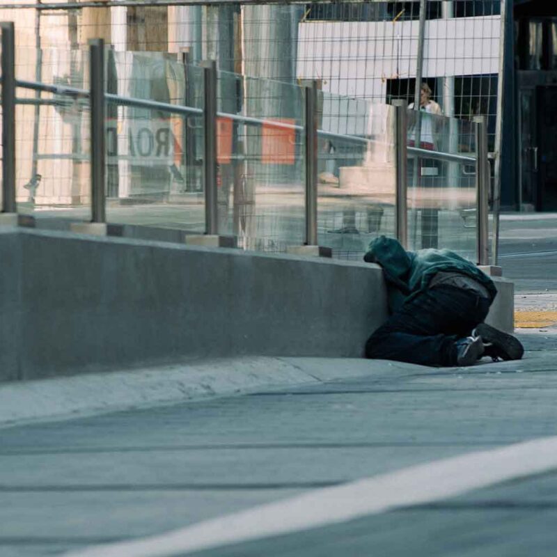 person sitting on street