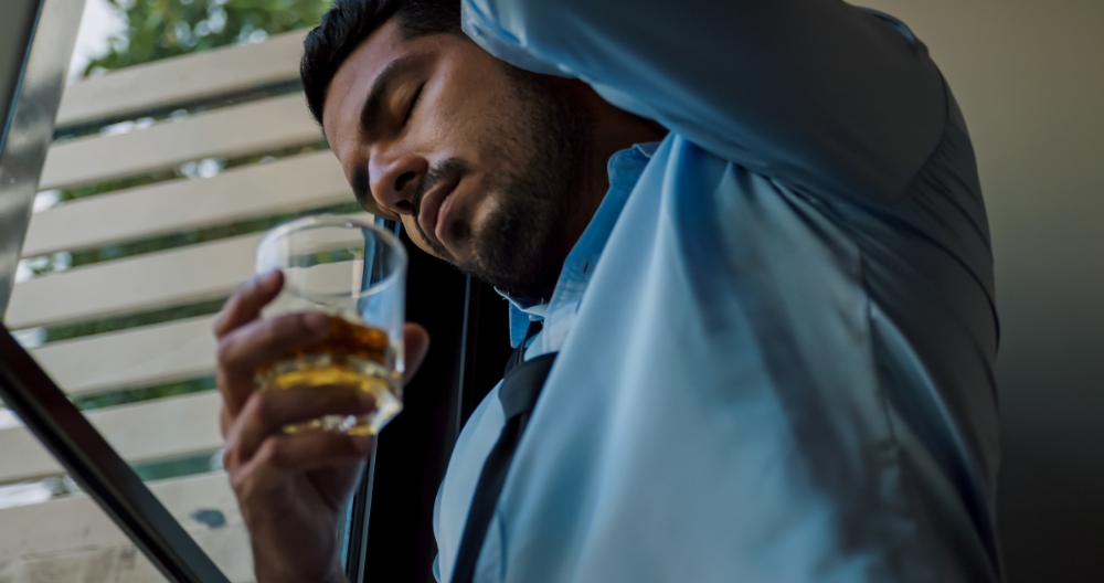 business man struggling with alcoholism