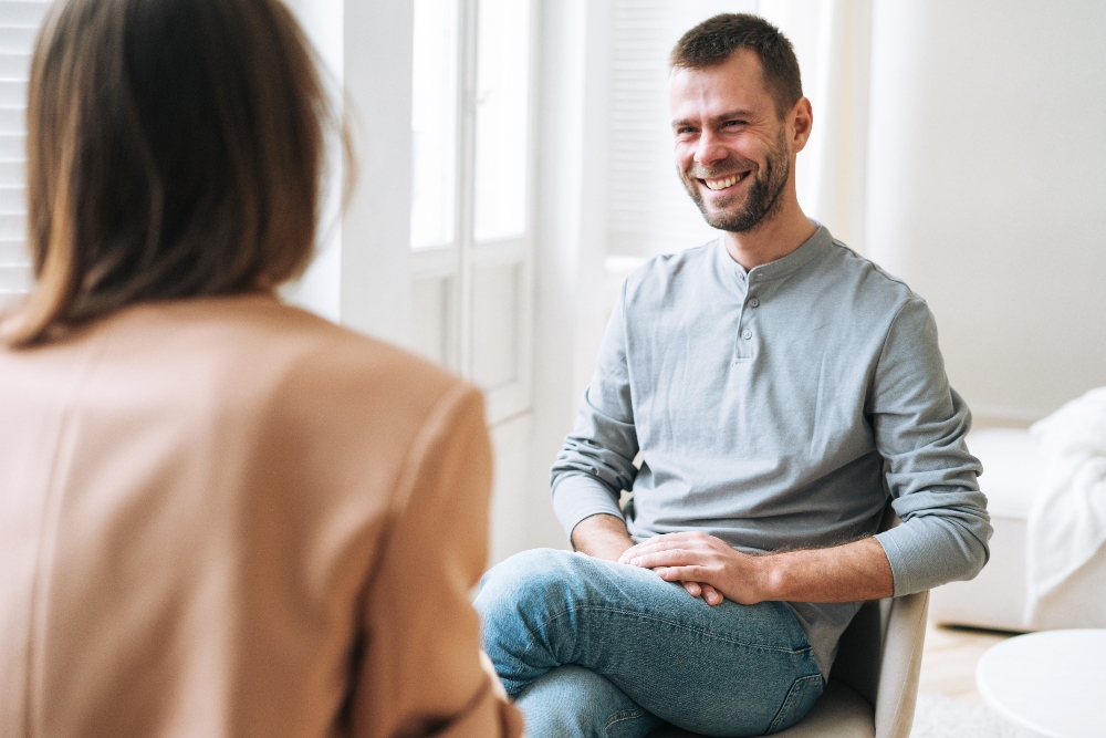 young man speaking to therapist