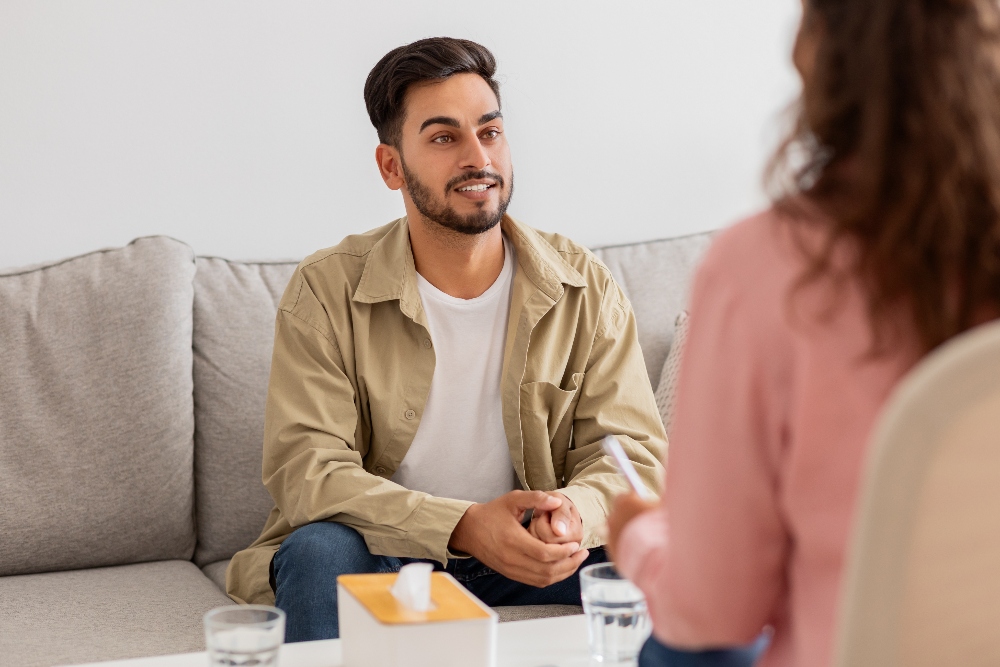 man speaking to therapist